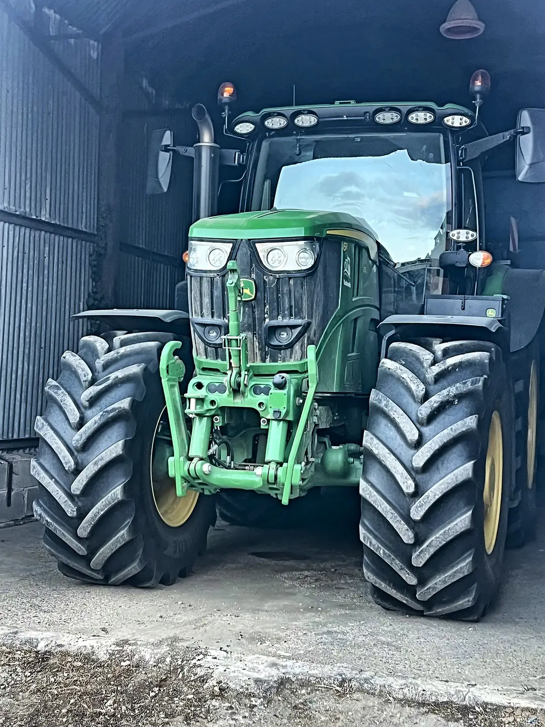 A modern tractor parked in the barn on the working Essex farm where KangalGuard began